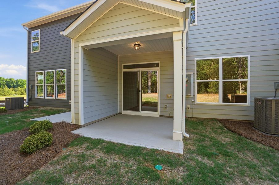 Exterior details and patio area of a home in Blythe Mill Townhomes, Waxhaw (Image 18).