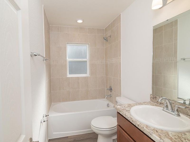 Secondary bedrooms share a convenient hall bath.