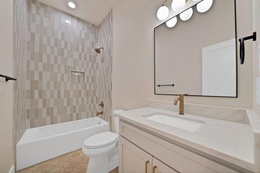 Full bathroom with shower / bathtub combination, vanity, and recessed lighting Full bathroom with shower / bathtub combination, vanity, and recessed lighting