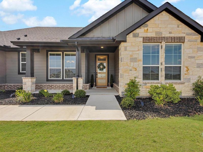 Front exterior of a new home in Regent Park, Springtown, TX, highlighting curb appeal (Image 22).