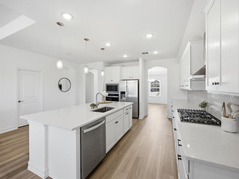 Kitchen view of single story three bedroom home with an office and a formal dining room