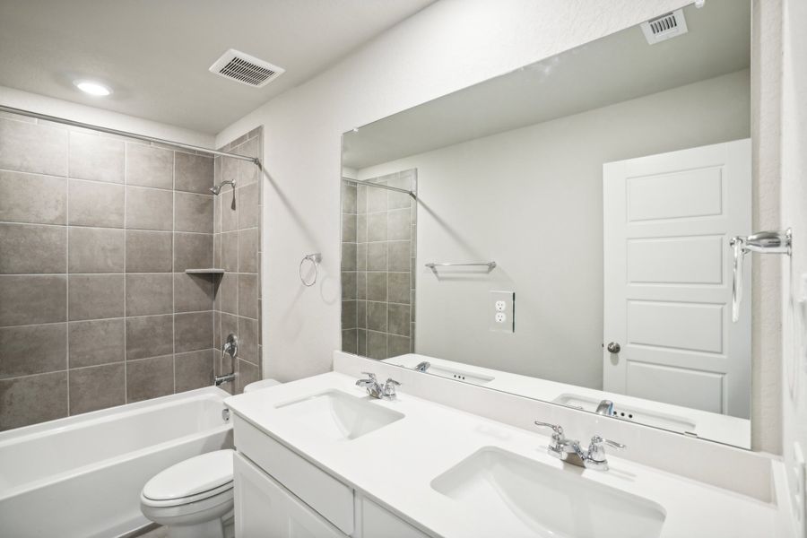 Guest bathroom of the Reynolds floorplan at a Meritage Homes community.