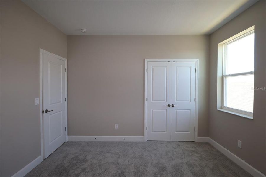 Spacious, unfurnished interior of a new home in Lake Star at Ovation, Winter Garden (Image 14).