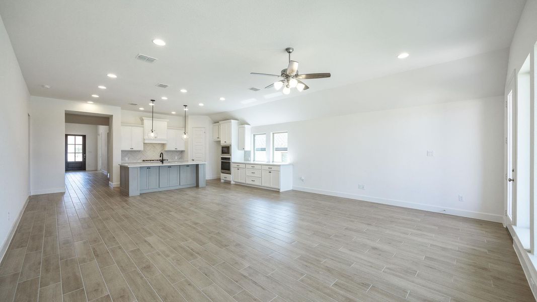 Unfurnished living room with recessed lighting, light wood finished floors, and ceiling fan
