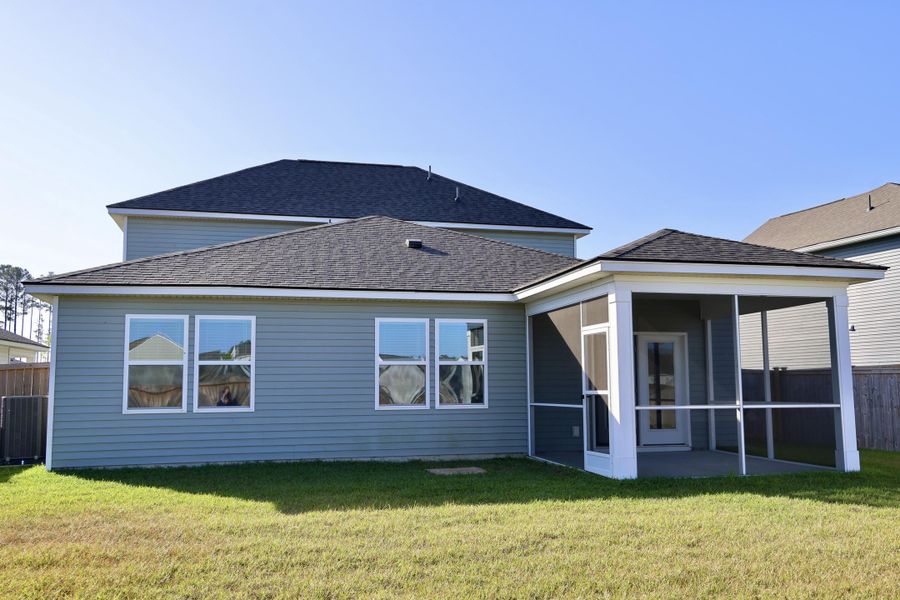 Exterior details and patio area of a home in Sanctuary Cove at Cane Bay, Summerville (Image 28).