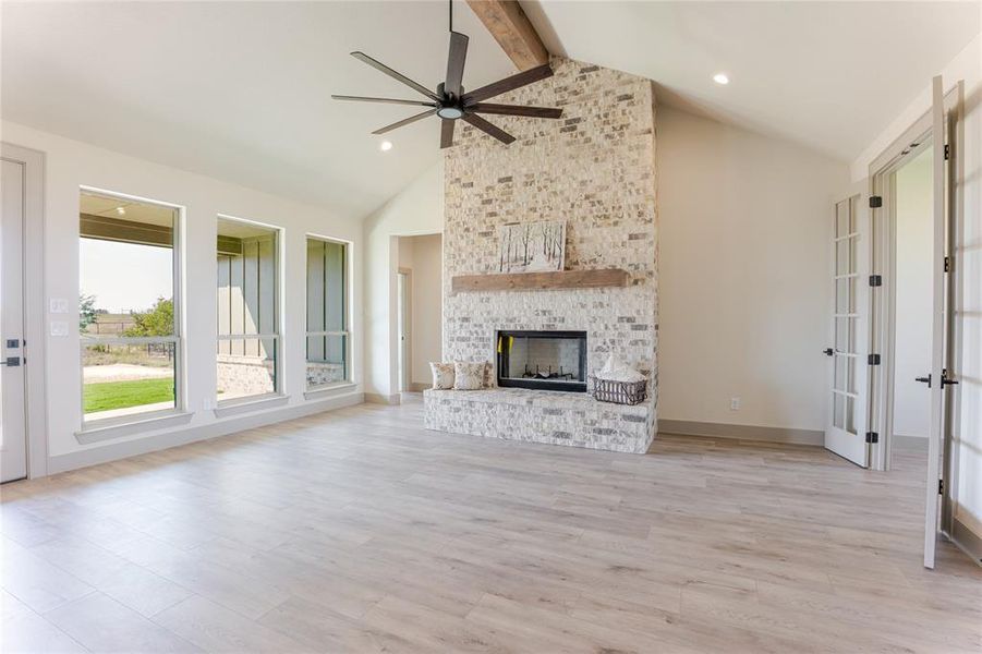Welcome into the main living space accented by this beautiful floor-to-ceiling fireplace. Welcome into the main living space accented by this beautiful floor-to-ceiling fireplace.