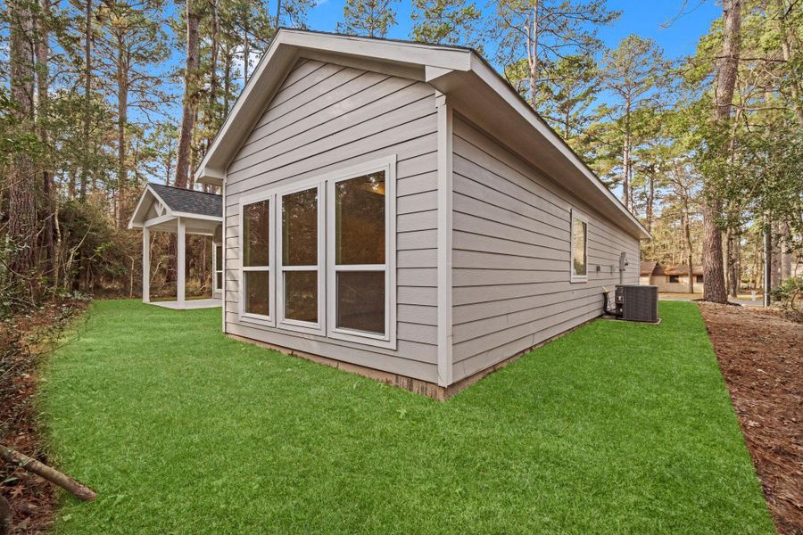 Exterior details and patio area of a home in , Trinity (Image 29).