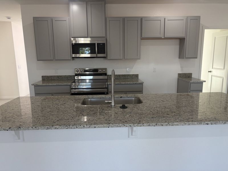 Furnished interior view inside a new home in Burnt Store Village, Punta Gorda (Image 7).