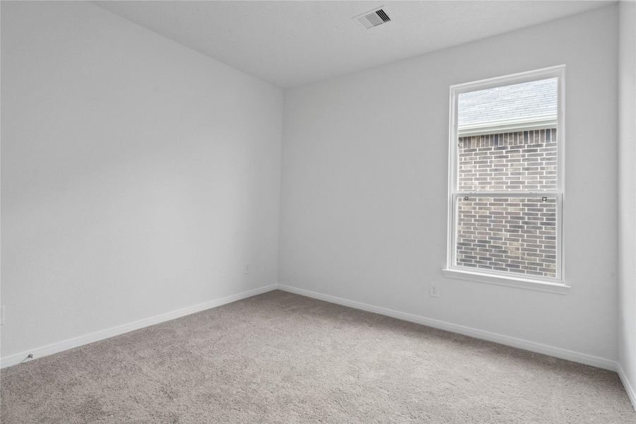 This home features 3 secondary bedrooms! This room also offers plush carpeting, large window with blinds, and a walk-in closet! This home features 3 secondary bedrooms! This room also offers plush carpeting, large window with blinds, and a walk-in closet!