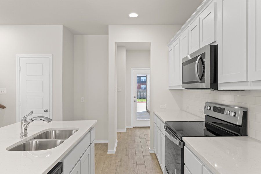 Front exterior of a new home in Sanger Circle, Sanger, TX, highlighting curb appeal (Image 10). Front exterior of a new home in Sanger Circle, Sanger, TX, highlighting curb appeal (Image 10).