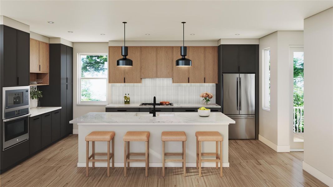 Kitchen featuring decorative light fixtures, stainless steel appliances, an island with sink, a breakfast bar area, and light stone countertops
