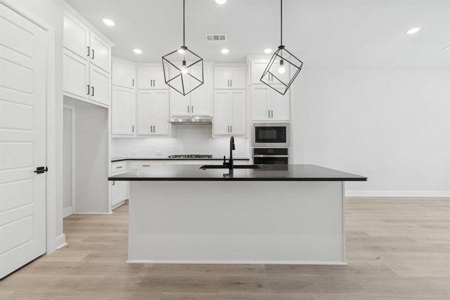 Furnished interior view inside a new home in Hillside at Las Colinas, Irving (Image 11). Furnished interior view inside a new home in Hillside at Las Colinas, Irving (Image 11).