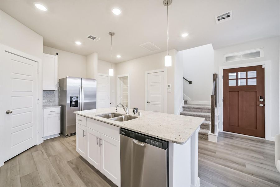 Gleaming stainless steel appliances. Gleaming stainless steel appliances.