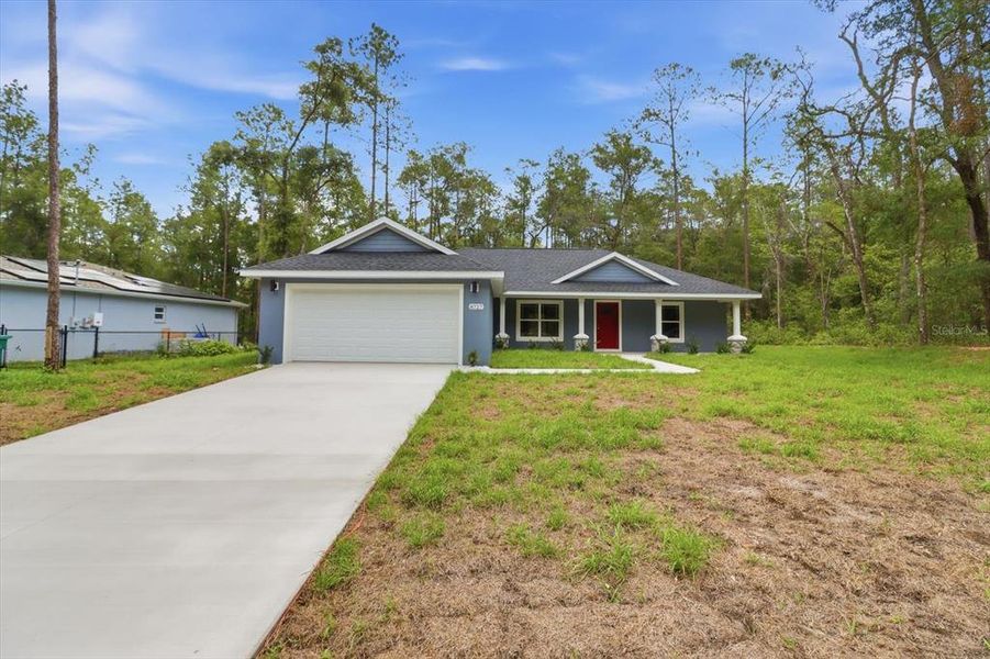 Front exterior of a new home in , Dunnellon, FL, highlighting curb appeal (Image 21).