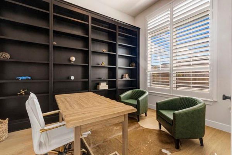 Office area featuring light wood-style flooring