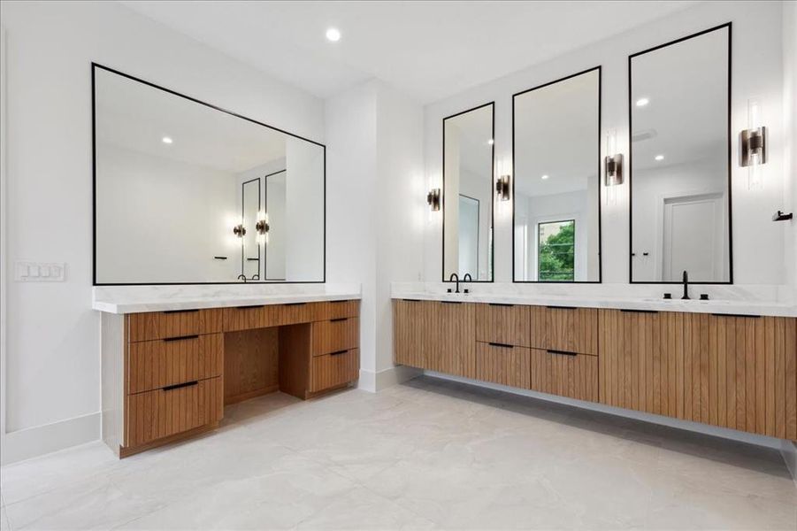 Bathroom featuring tile flooring and double vanity