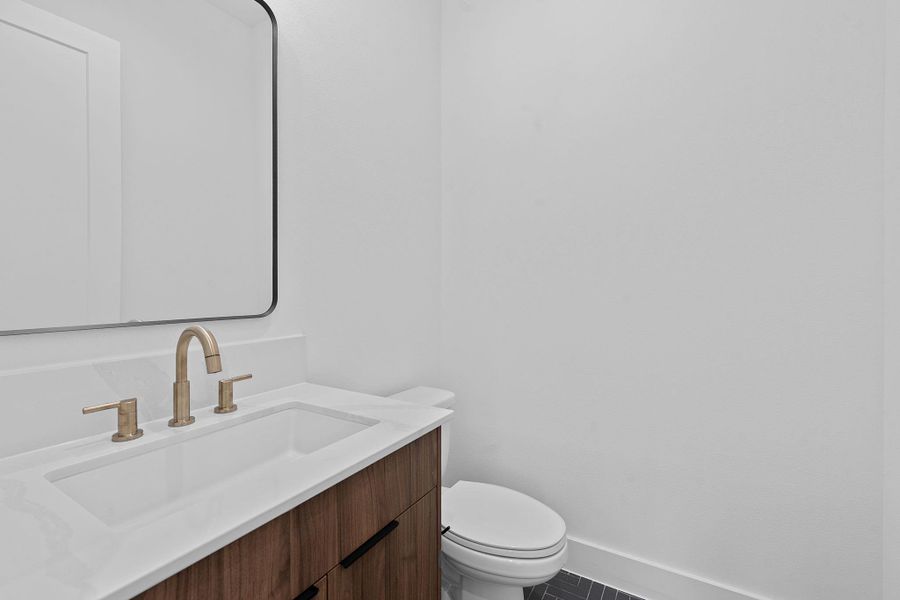 Half bath with vanity and toilet