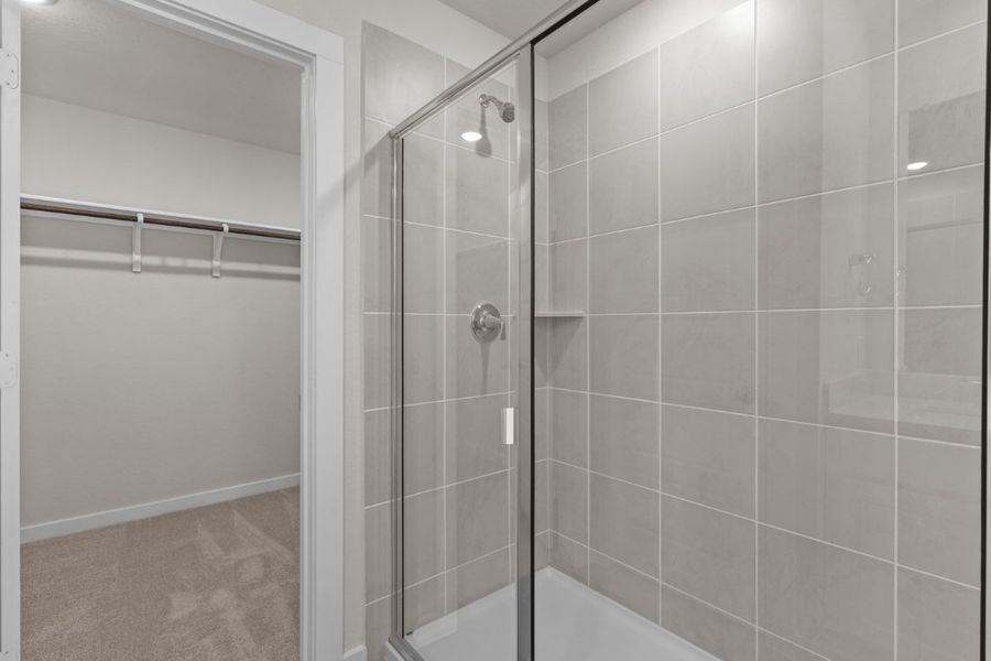 A shower with a glass door. A shower with a glass door.