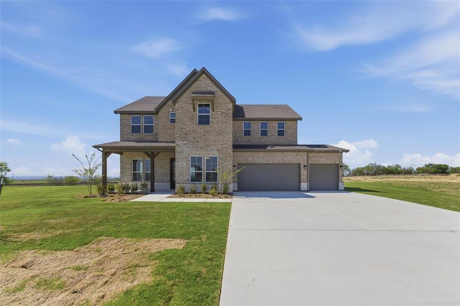 View of front of property with brick siding, a front lawn, covered porch, concrete driveway, and an attached garage View of front of property with brick siding, a front lawn, covered porch, concrete driveway, and an attached garage