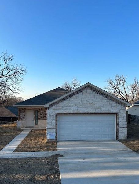 Ranch-style home featuring two car garage