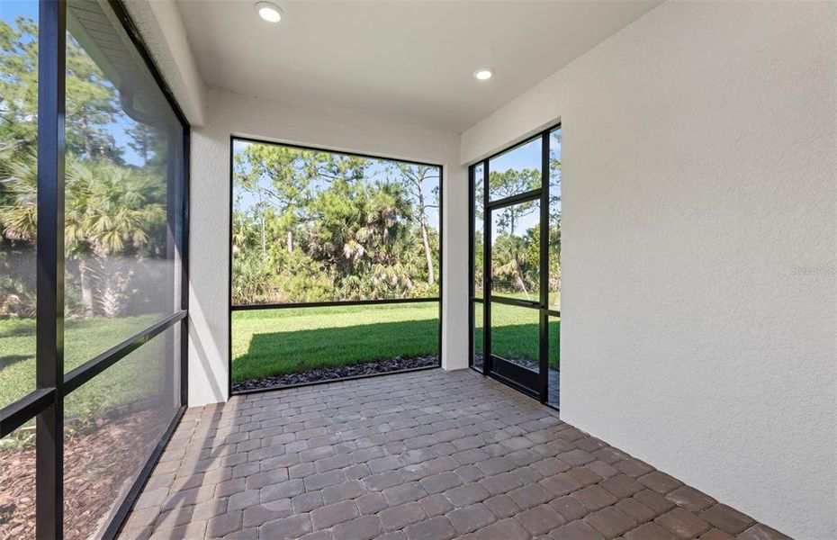 Exterior details and patio area of a home in Cedar Grove at The Woodlands, North Port (Image 3).