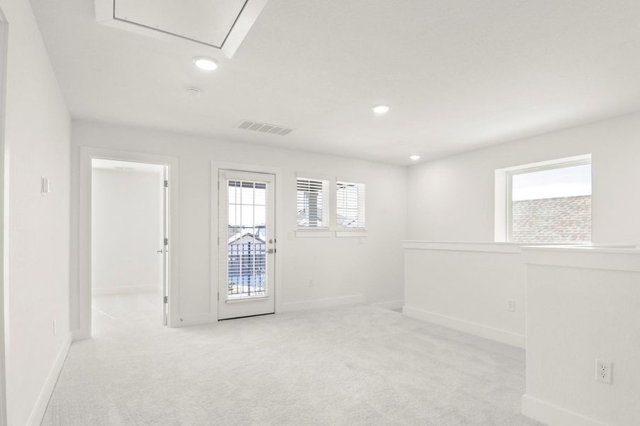 Unfurnished room with light carpet and recessed lighting Unfurnished room with light carpet and recessed lighting