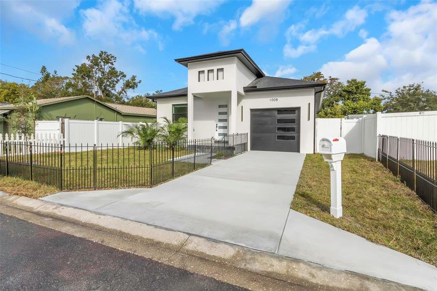 Front exterior of a new home in , Clearwater, FL, highlighting curb appeal (Image 1).