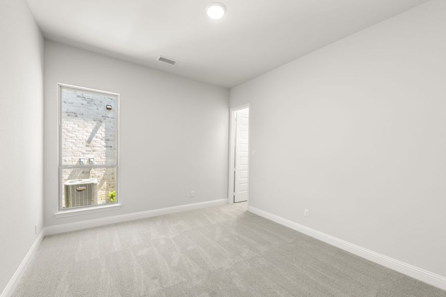 Representative unfurnished interior of a home built from the Jordan by Windsor Homes in Nelson Lake Estates, Rockwall (Image 20).