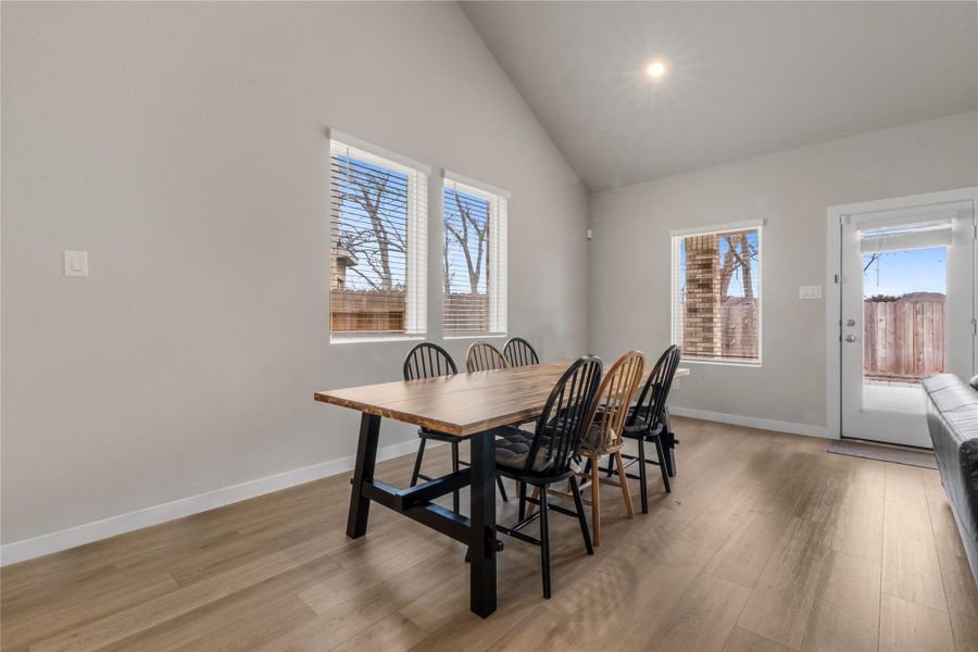 Bright and inviting dining area conveniently located near the kitchen, offering a comfortable space for family meals and gatherings, with a layout that accommodates both casual and formal dining setups.
