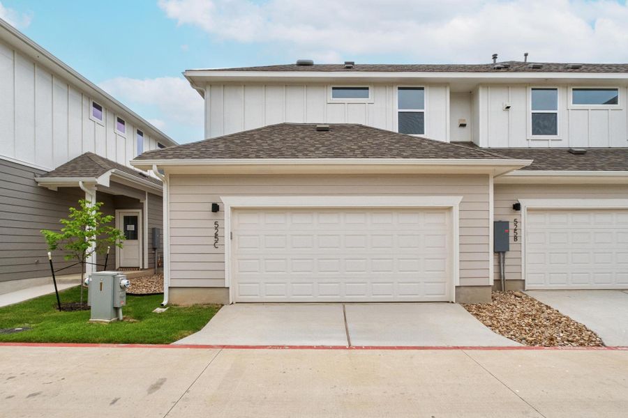 Front exterior of a new home in , Buda, TX, highlighting curb appeal (Image 17).