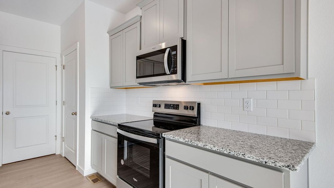 Furnished interior view inside a new home in Silver Peaks, Lochbuie (Image 8).