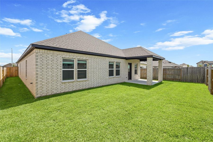 Exterior details and patio area of a home in Sunterra, Katy (Image 4).