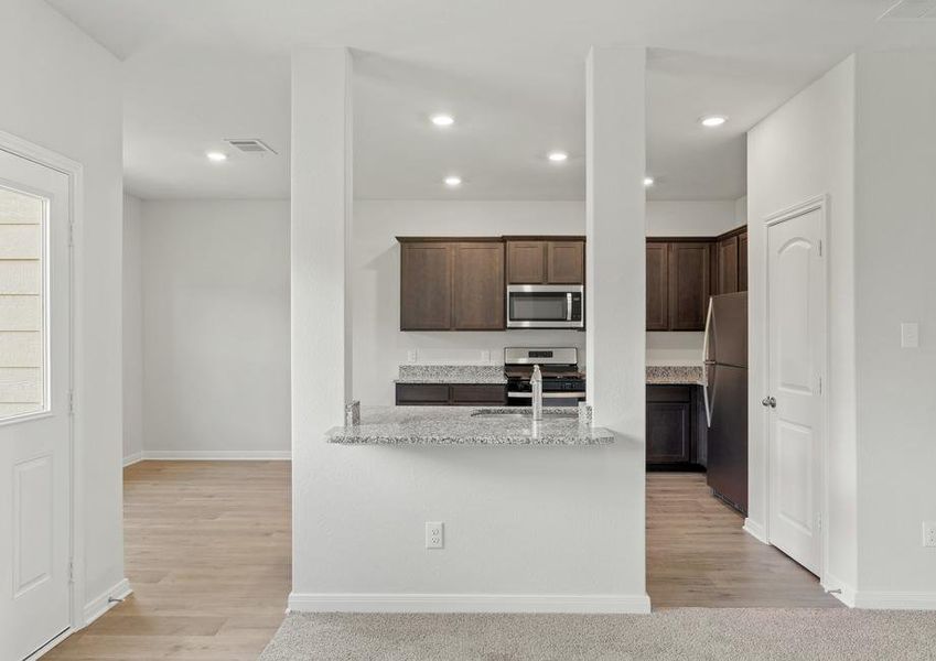 The kitchen of the Colorado sits in between the dining room and family room.