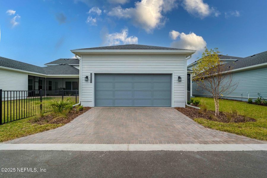 Front exterior of a new home in Seven Pines 50' Rear Entry, Jacksonville, FL, highlighting curb appeal (Image 29).
