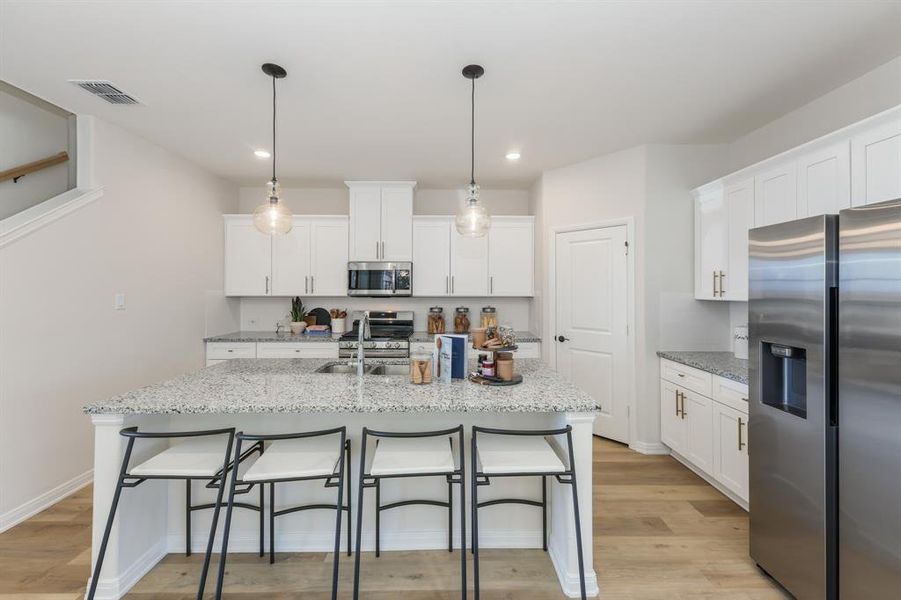 The nicely sized island is the hub of your new dream kitchen and the perfect place for friends and family to gather! The nicely sized island is the hub of your new dream kitchen and the perfect place for friends and family to gather!