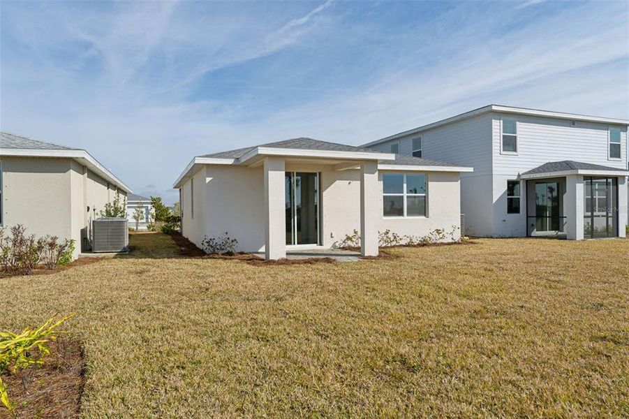 Exterior details and patio area of a home in Crescent Lakes - Premier Series, Punta Gorda (Image 22).