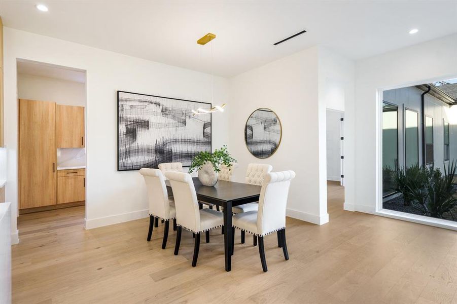 Dining area featuring light wood-type flooring