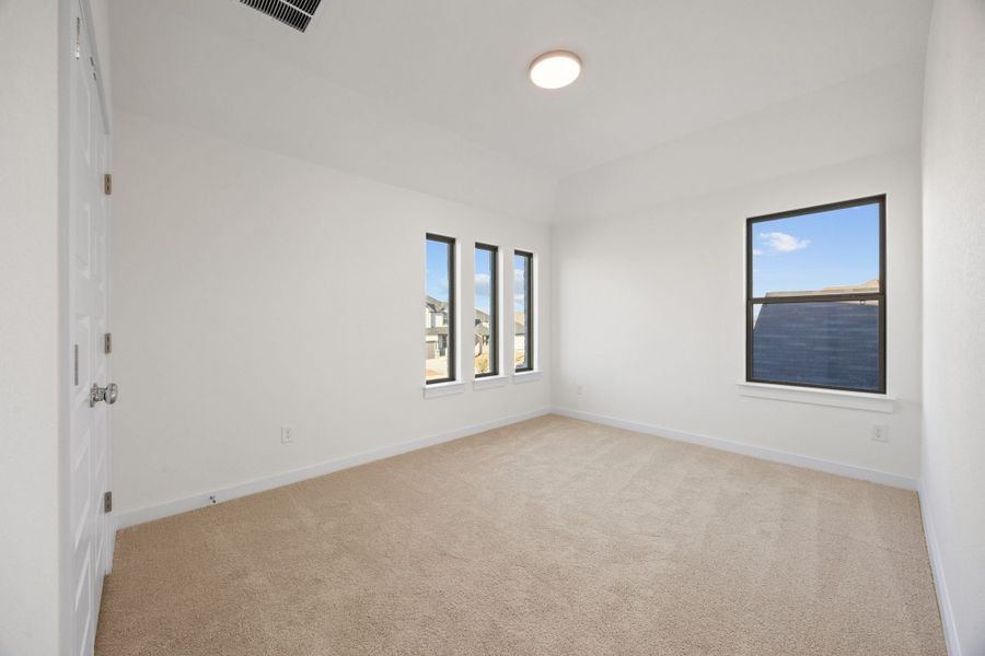 Bedroom in the Pearl home plan by Trophy Signature Homes – REPRESENTATIVE PHOTO