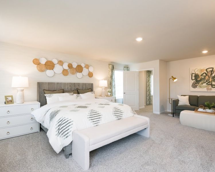 The primary suite is a private retreat to relax and unwind.