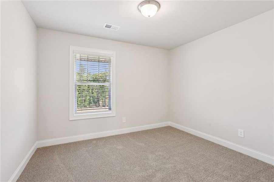 Spacious, unfurnished interior of a new home in Hemingway - Highland Series, Cumming (Image 31).