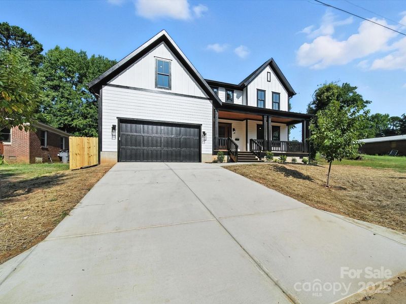 Front exterior of a new home in , Charlotte, NC, highlighting curb appeal (Image 23).