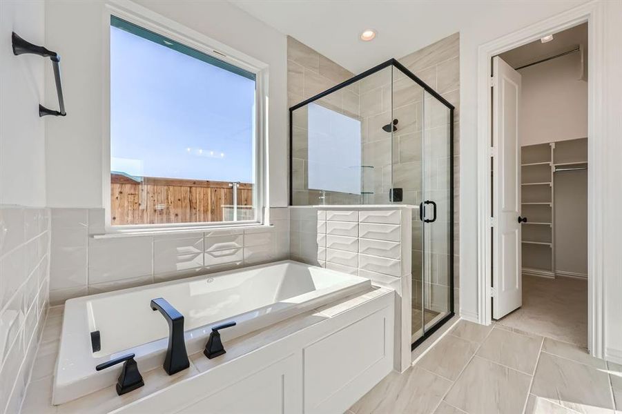 Bathroom featuring separate shower and tub