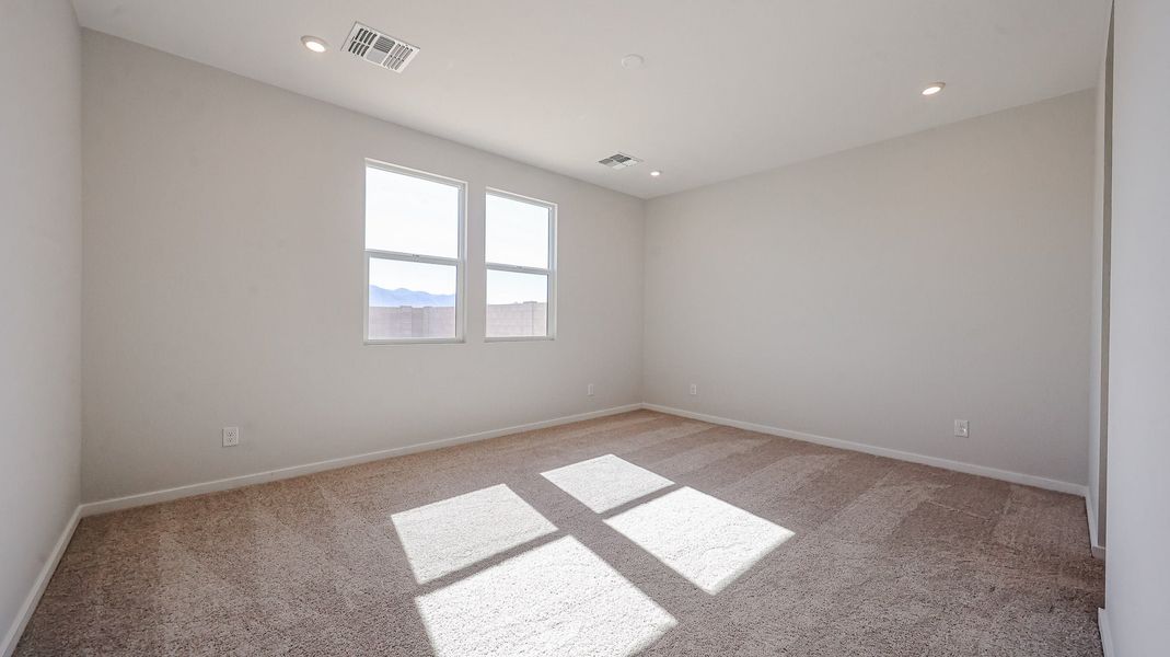 A room with a rug and windows. A room with a rug and windows.