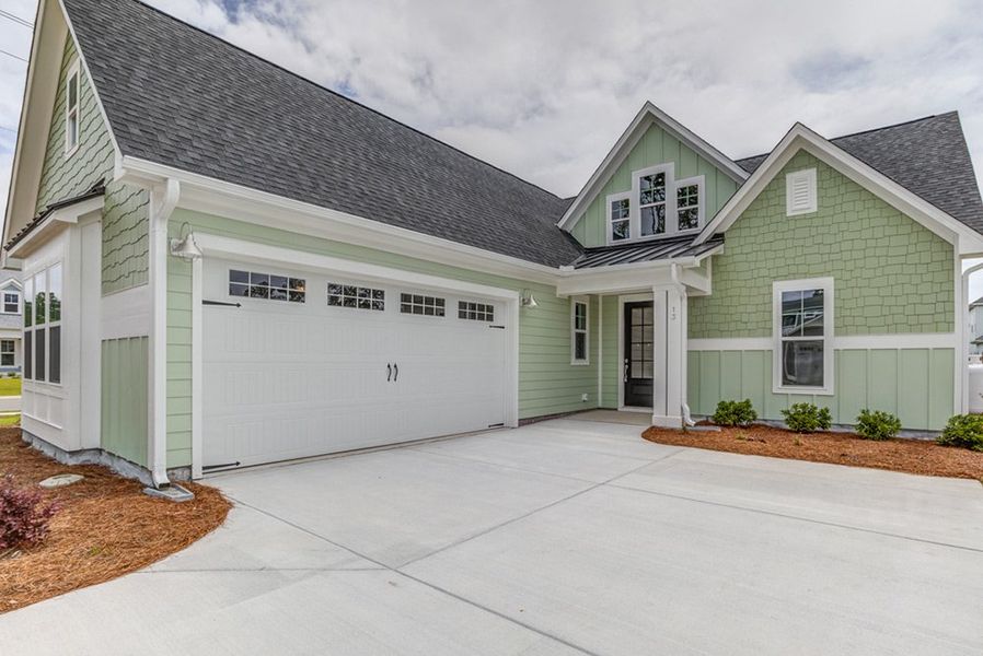 Representative exterior photo of a completed home built from the The Amherst by RobuckHomes in Windwater, Hampstead, NC (Image 21).