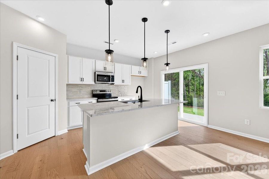 Light filled kitchen with access to extended outdoor living Light filled kitchen with access to extended outdoor living