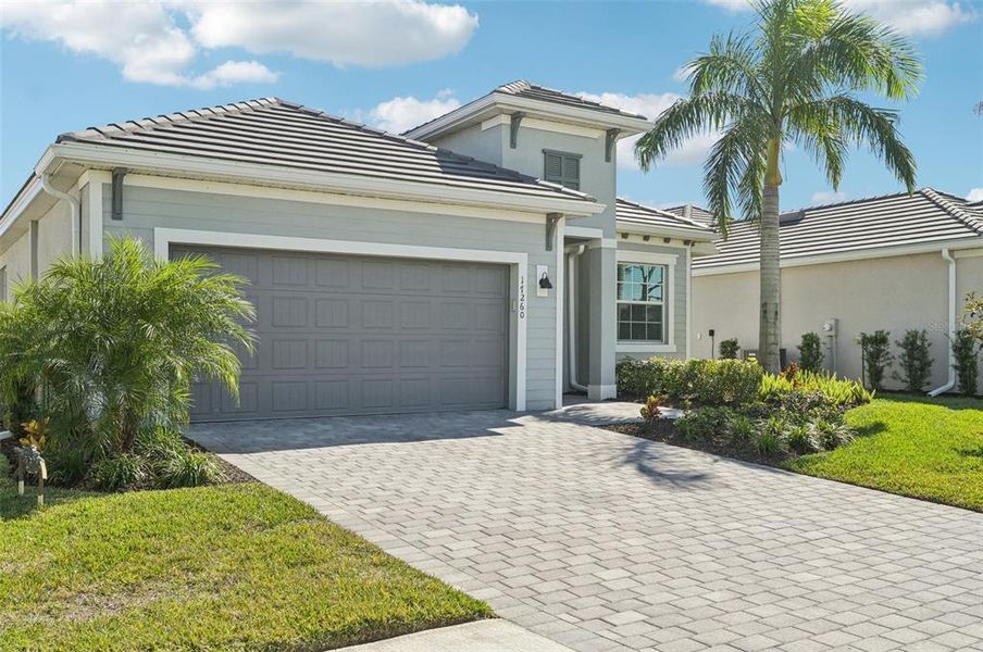Front exterior of a new home in , Venice, FL, highlighting curb appeal (Image 26).