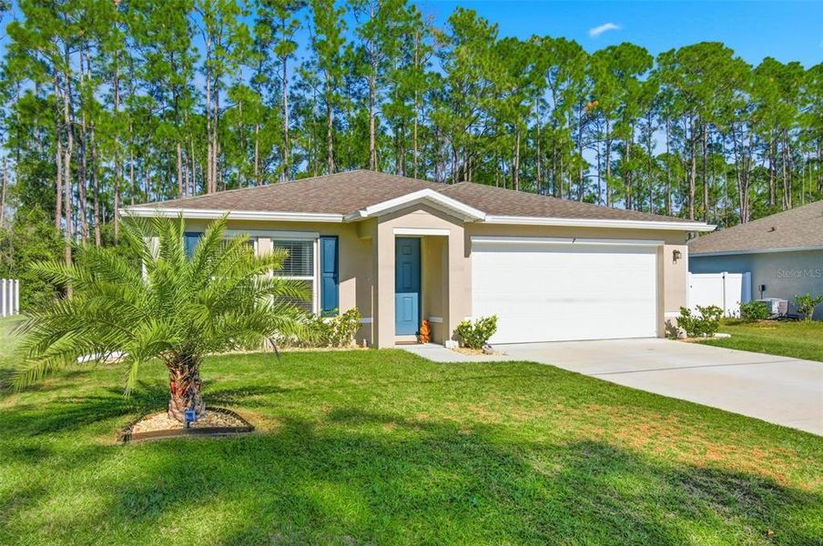 Front exterior of a new home in , Palm Coast, FL, highlighting curb appeal (Image 24).
