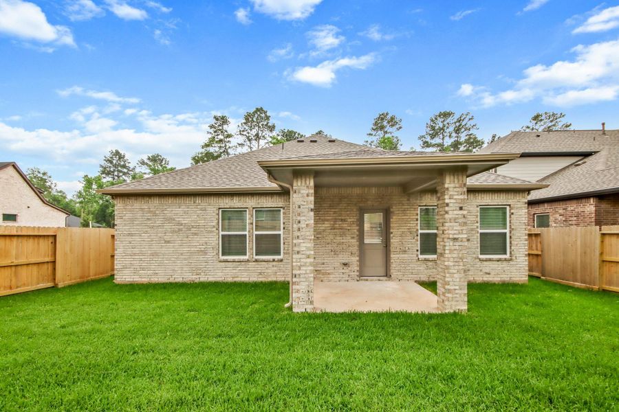 Exterior details and patio area of a home in The Woodlands Hills, Willis (Image 3). Exterior details and patio area of a home in The Woodlands Hills, Willis (Image 3).