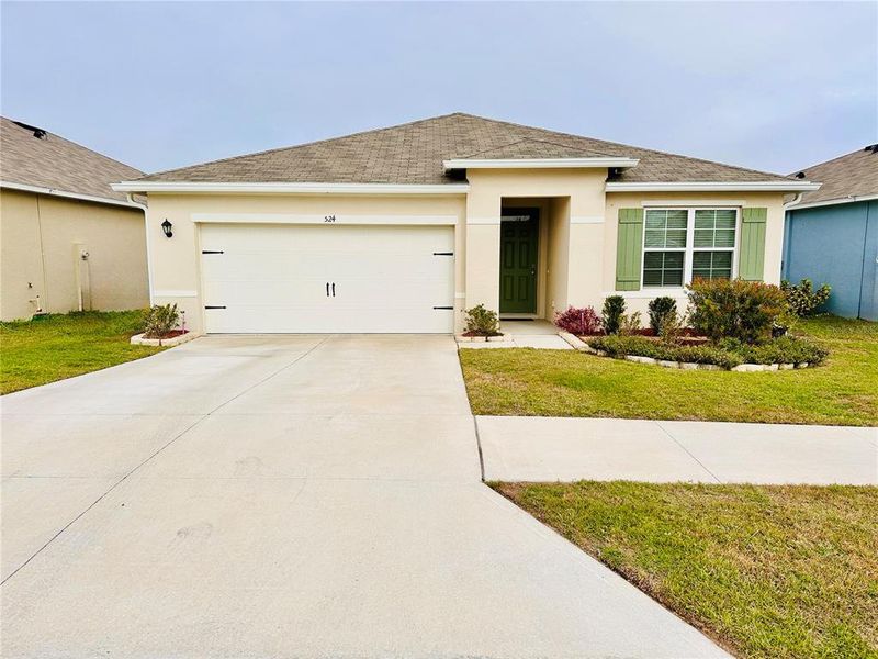 FRONT OF HOME WITH BEAUTIFUL LANDSCAPING