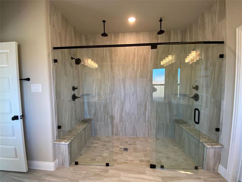 AMAZING extended master shower has frameless glass, tile pan, 2 benches, 2 shower heads, and 2 rain heads! AMAZING extended master shower has frameless glass, tile pan, 2 benches, 2 shower heads, and 2 rain heads!